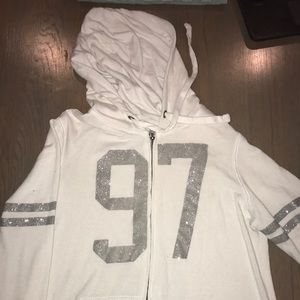 A white zip up hoddie.